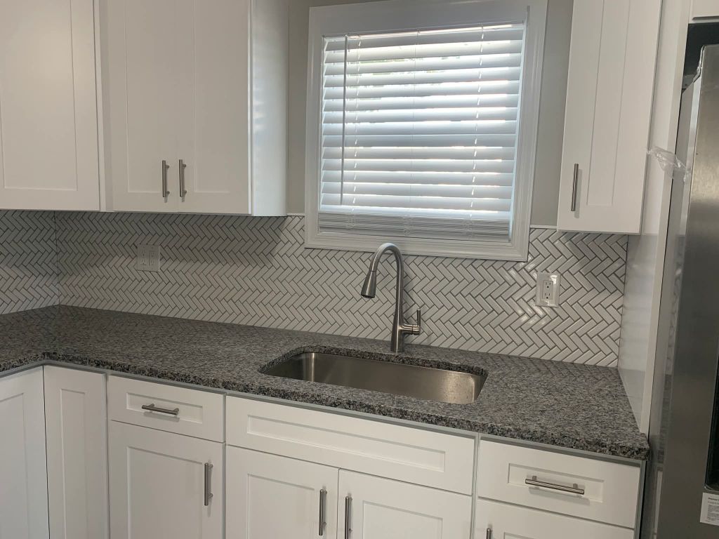 Herringbone tile kitchen backsplash